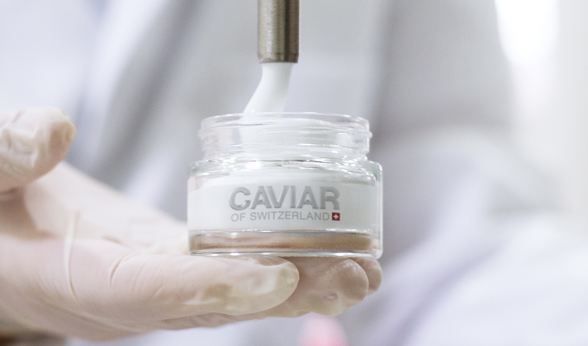 Lab technician testing Caviar of Switzerland cream — clinical rigour